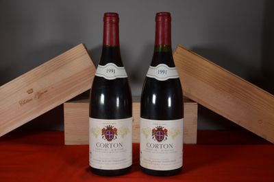 two bottles of wine sitting next to each other on a table