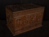 an old wooden chest with carvings and carvings on the sides