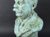 a close up of a statue of a man with a beard