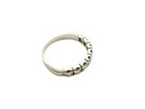 a close up of a silver ring on a white background