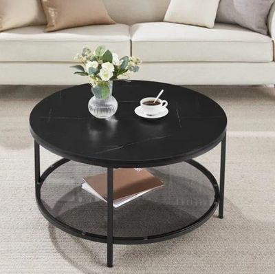 a coffee table with a vase of flowers on top of it