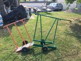 a small green cart with a skateboard on it in the yard