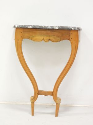 a small wooden table with a marble top on it