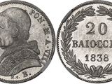 a silver coin with a portrait of a man on it