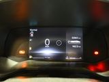 the dashboard of a car with a digital display on it