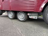a red truck that is parked on the side of the road