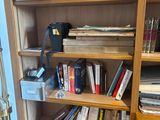 a bookshelf with a bunch of books on it