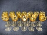 a lot of wine glasses that are sitting on a table