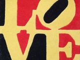 a picture of a painting of the word love in red, yellow, and black
