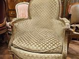 a chair that is sitting in a room with a lot of furniture