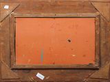 an old picture frame with an orange background and a small hole in the middle