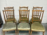 four chairs are lined up in a row on the floor