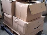 boxes stacked on top of each other on a pallet in a warehouse