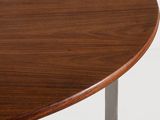 close up of a wooden table with metal legs and a wooden table top
