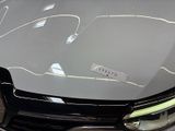 a close up of a car with a sticker on it ' s hood