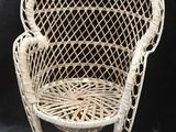 an image of a wicker chair on a black background