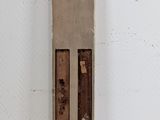 an image of a tall piece of wood that is on a wall
