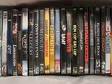 a lot of dvd ' s in a box on the table