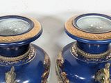 pair of blue vases with gold accents on a white background