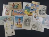 a lot of old children ' s postcards on the table