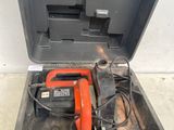 a tool in the case that is open on the floor