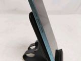 a cell phone that is sitting on a stand