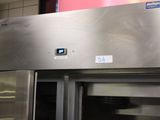 a large stainless steel refrigerator with a glass door