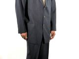 the man in the suit is posing for a picture