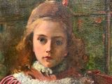 portrait of a young girl in a red dress with a feathered hat