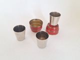 three cups sitting next to each other on a white surface