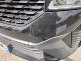 a close up of the front of a car with a license plate on it