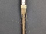 a wooden stick with a stick sticking out of it