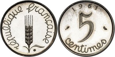a close up of a coin with the number five on it