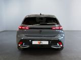 the rear view of a grey car in a showroom