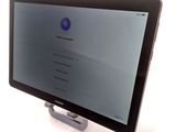 a tablet computer that is sitting on top of a stand