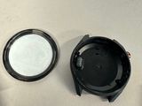 a white counter top with a black and white bowl and a black and white cup