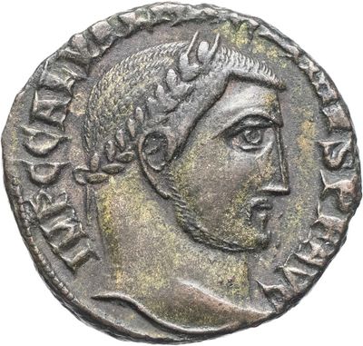 une pièce d'argent sur laquelle figurent le visage d'une femme et une couronne