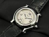 a close up of a watch on a black cloth