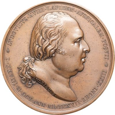 une image représentant une médaille de bronze sur laquelle figure le visage d'un homme