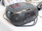 a radio that is sitting on a table next to a hair dryer