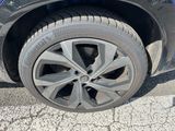 a close up of a tire on a blue car