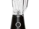 the blender is black and has a glass jar on top of it