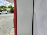 a white refrigerator sitting on the side of a building