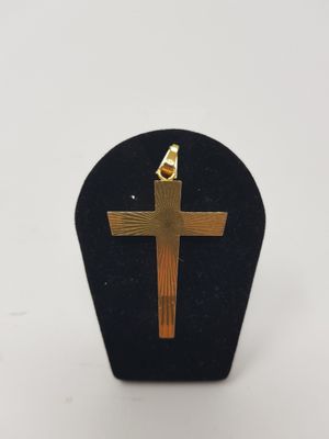 a close up of a wooden cross on a black stand