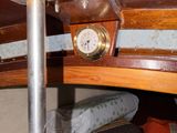 a clock that is on the side of a bunk bed