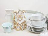 a lot of plates and cups on the table
