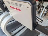 a close up of a row of tread machines in a gym