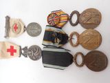 many medals and medals on a white surface