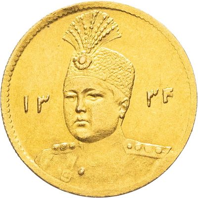 un gros plan d'une pièce d'or sur laquelle figure l'image d'un homme coiffé d'un chapeau