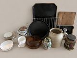 many different types of dishes and pans on the table